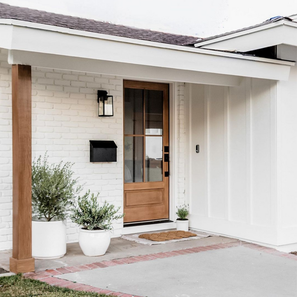 white brick house with wood front door