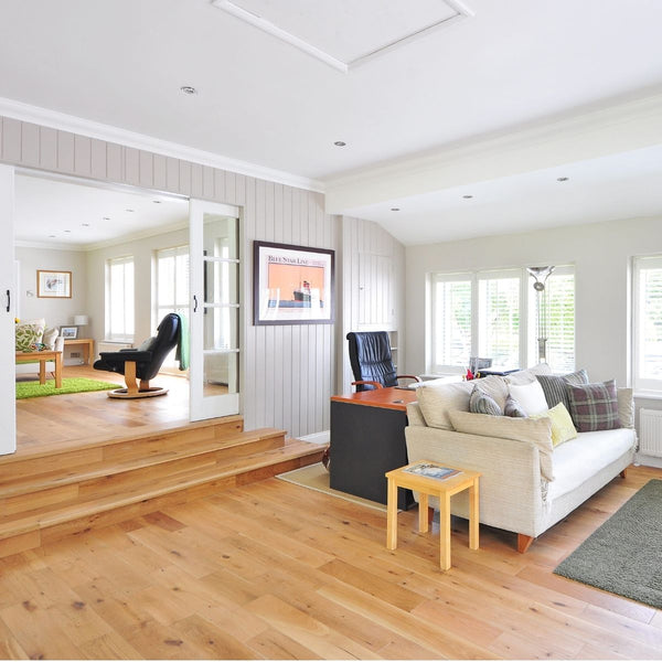 living room with hardwood floor and white couch